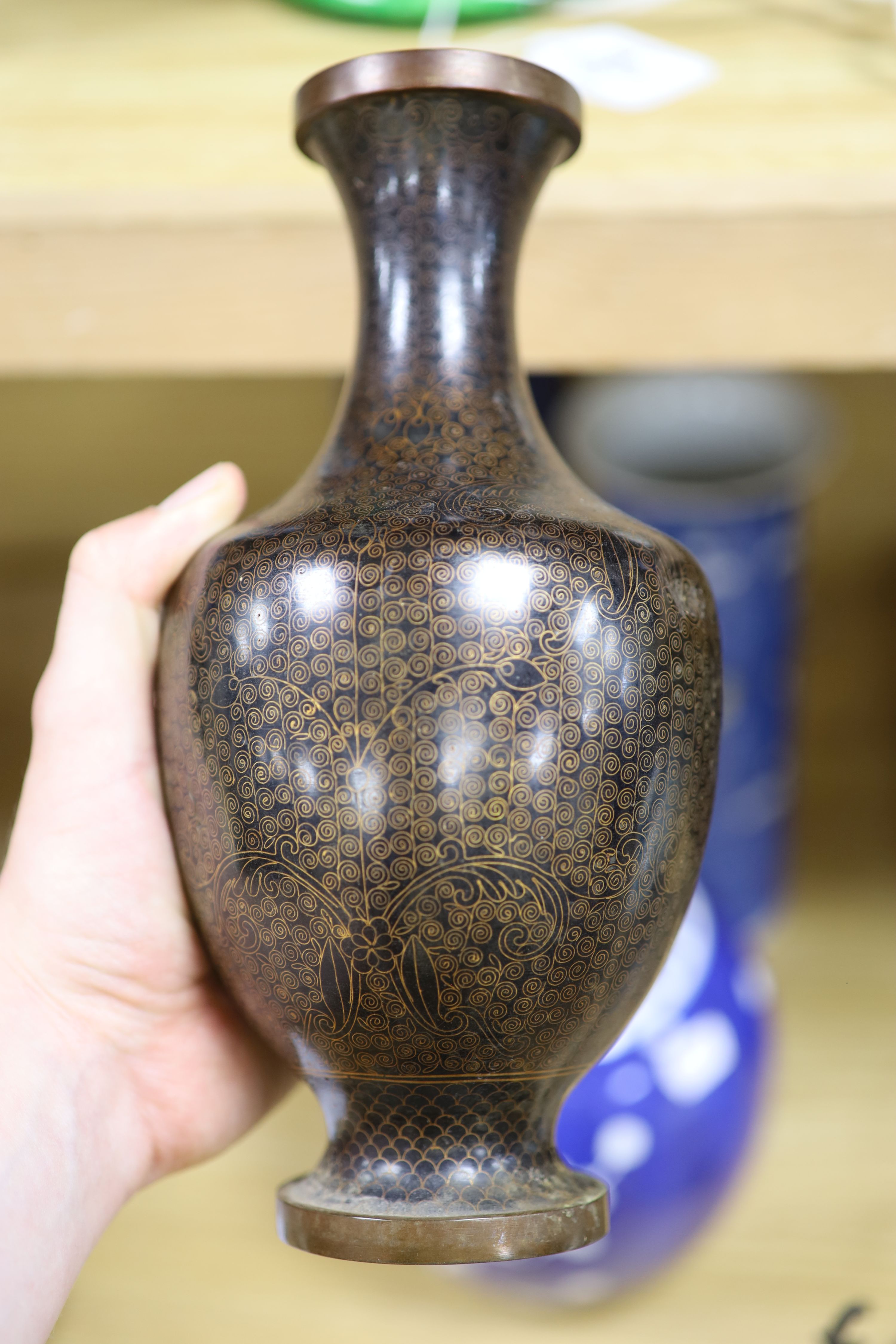 A Chinese blue and white cylindrical vase, another vase and cover and a blue and white jar and cover, together with a cloisonne vase and a bronze censer, tallest 32cm